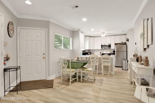 1800 The Greens Way Unit 605, Jacksonville Beach, FL 32250 - dining room with light wood-type flooring, ornamental molding, recessed lighting, and a ceiling fan
