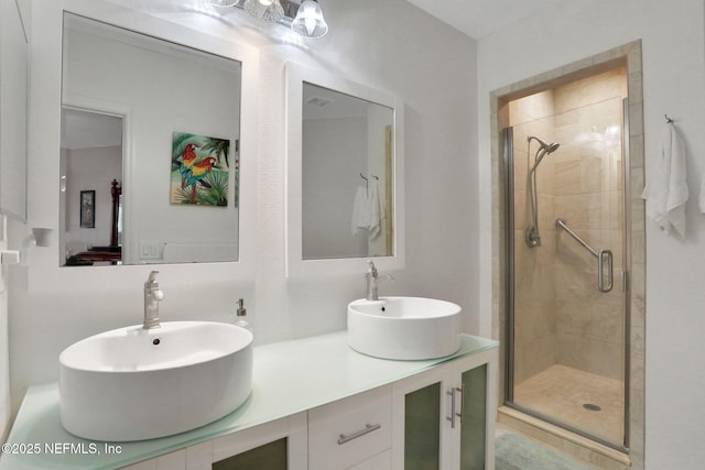 1800 The Greens Way Unit 605, Jacksonville Beach, FL 32250 - bathroom featuring a shower stall and double vanity