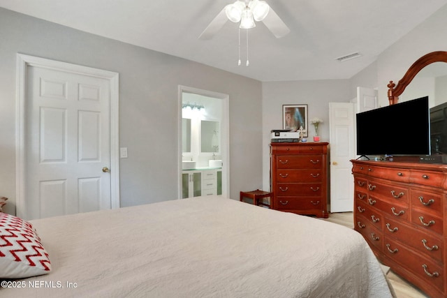 1800 The Greens Way Unit 605, Jacksonville Beach, FL 32250 - bedroom with ceiling fan, ensuite bathroom, and wood finished floors