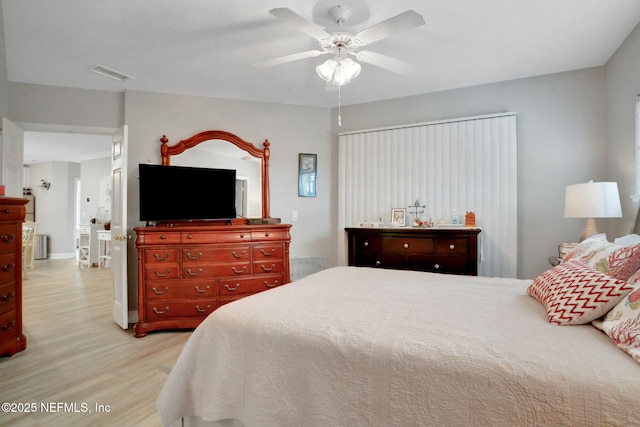 1800 The Greens Way Unit 605, Jacksonville Beach, FL 32250 - bedroom featuring wood finished floors and a ceiling fan