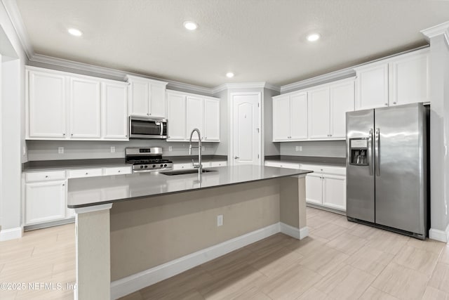 3024 Las Calinas Blvd, Saint Augustine, FL 32095 - kitchen featuring appliances with stainless steel finishes, dark countertops, white cabinets, crown molding, and recessed lighting