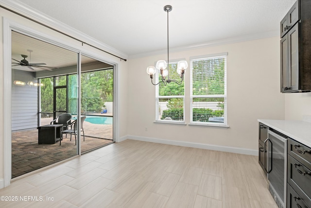 3024 Las Calinas Blvd, Saint Augustine, FL 32095 - dining room featuring wine cooler, a chandelier, crown molding, and ceiling fan