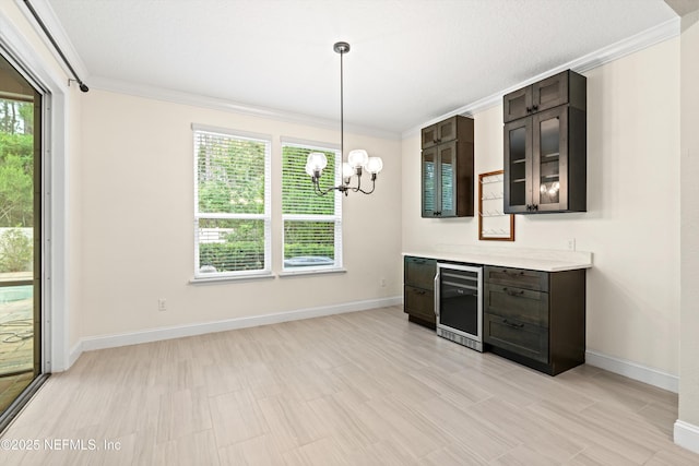 3024 Las Calinas Blvd, Saint Augustine, FL 32095 - unfurnished dining area with beverage cooler, ornamental molding, and a chandelier