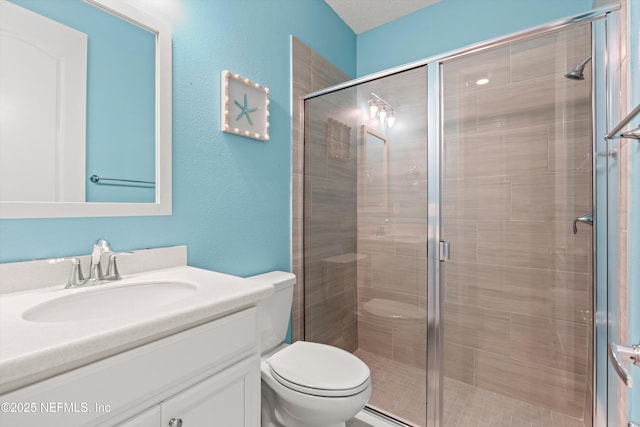 3024 Las Calinas Blvd, Saint Augustine, FL 32095 - bathroom featuring vanity, a shower stall, and a textured wall