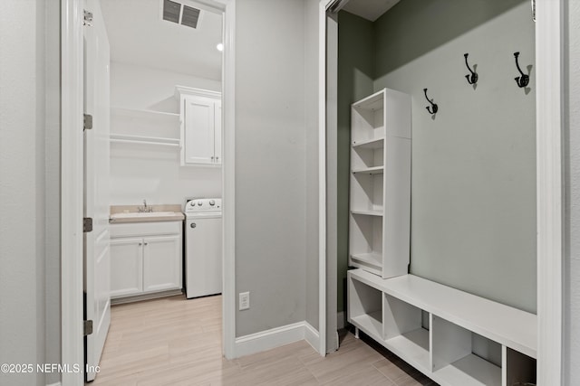 3024 Las Calinas Blvd, Saint Augustine, FL 32095 - mudroom featuring washer / clothes dryer and light wood-type flooring