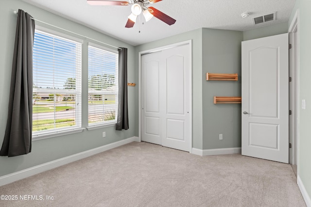 3024 Las Calinas Blvd, Saint Augustine, FL 32095 - unfurnished bedroom with carpet floors, a closet, and a ceiling fan