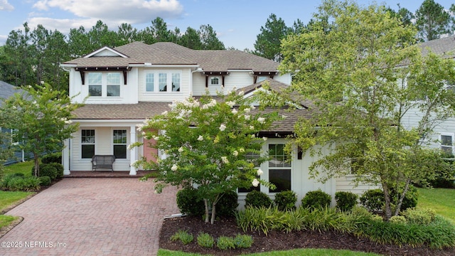 21 Mollusk Rd, Saint Johns, FL 32259 - view of front facade featuring a shingled roof and decorative driveway