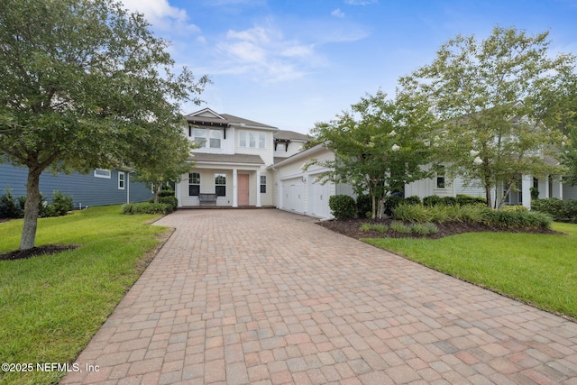 21 Mollusk Rd, Saint Johns, FL 32259 - view of front of home with decorative driveway, a garage, and a front yard