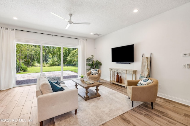 21 Mollusk Rd, Saint Johns, FL 32259 - living room featuring a textured ceiling, light wood-style flooring, a ceiling fan, and recessed lighting