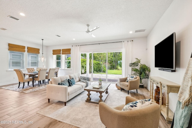 21 Mollusk Rd, Saint Johns, FL 32259 - living area featuring a textured ceiling, light wood finished floors, a ceiling fan, and recessed lighting