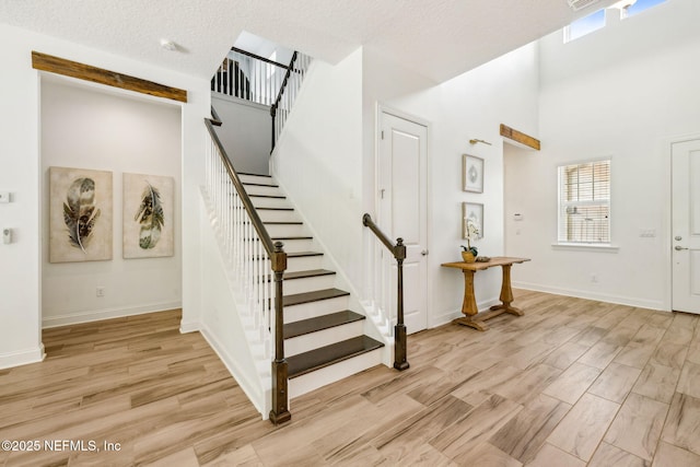 21 Mollusk Rd, Saint Johns, FL 32259 - foyer with a towering ceiling, stairway, and light wood-style floors