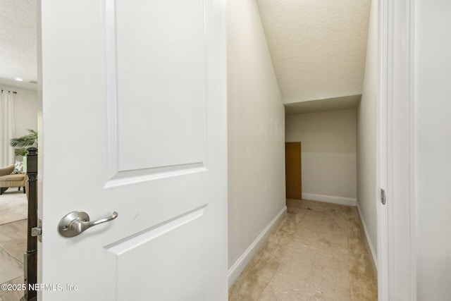 21 Mollusk Rd, Saint Johns, FL 32259 - hallway featuring a textured ceiling and light carpet