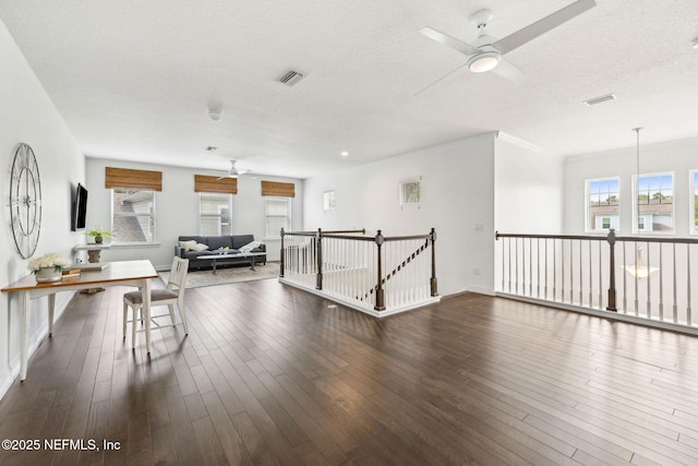 21 Mollusk Rd, Saint Johns, FL 32259 - living room featuring a ceiling fan, a textured ceiling, and dark wood-type flooring