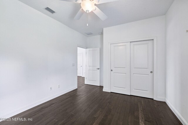 21 Mollusk Rd, Saint Johns, FL 32259 - unfurnished bedroom featuring dark wood-style floors, a closet, and a ceiling fan