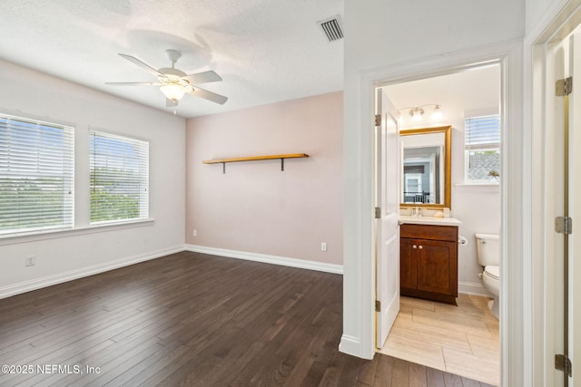 21 Mollusk Rd, Saint Johns, FL 32259 - empty room with healthy amount of natural light, wood finished floors, a ceiling fan, and a textured ceiling