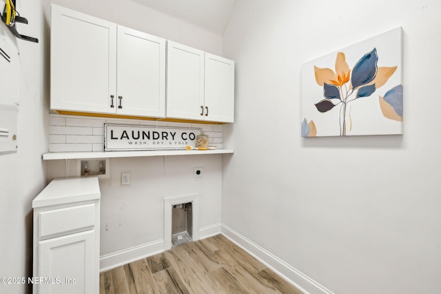 21 Mollusk Rd, Saint Johns, FL 32259 - laundry area featuring cabinet space, electric dryer hookup, light wood-style floors, and hookup for a washing machine