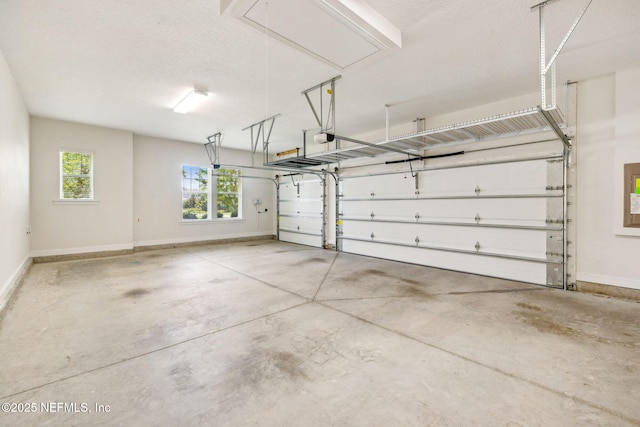 21 Mollusk Rd, Saint Johns, FL 32259 - garage featuring baseboards and a garage door opener