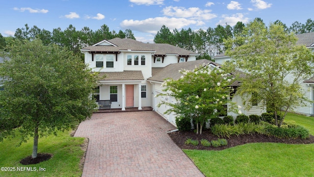 21 Mollusk Rd, Saint Johns, FL 32259 - view of front of house featuring decorative driveway, an attached garage, and a front lawn