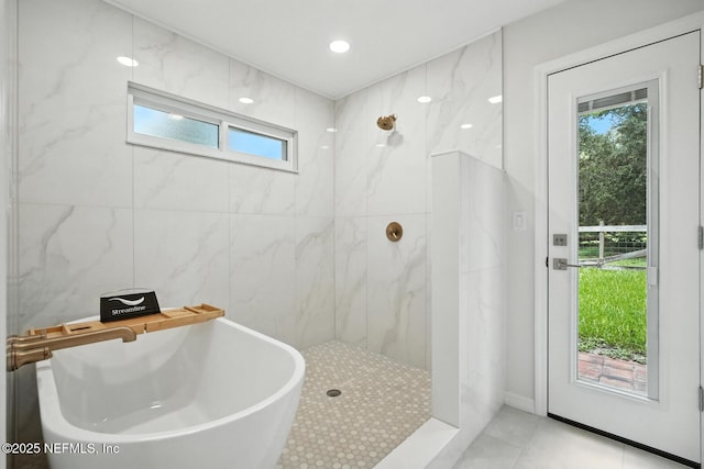 2181 Glenwood Hammock Rd, Deland, FL 32720 - full bath with a soaking tub, a marble finish shower, and tile patterned floors
