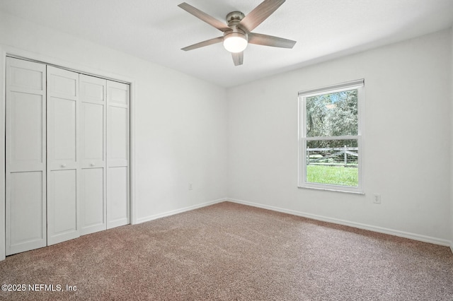 2181 Glenwood Hammock Rd, Deland, FL 32720 - unfurnished bedroom featuring carpet floors, a closet, and ceiling fan