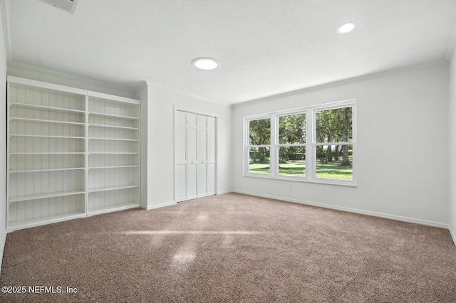 2181 Glenwood Hammock Rd, Deland, FL 32720 - unfurnished bedroom featuring carpet floors, a closet, crown molding, and recessed lighting