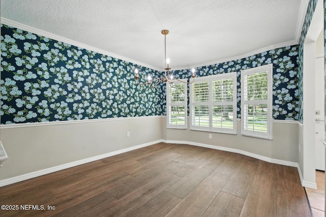 2181 Glenwood Hammock Rd, Deland, FL 32720 - spare room featuring wallpapered walls, crown molding, wood finished floors, and a textured ceiling