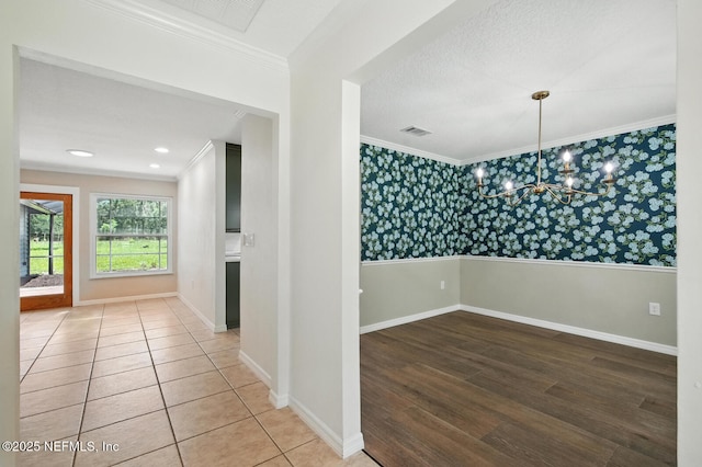2181 Glenwood Hammock Rd, Deland, FL 32720 - hall featuring wallpapered walls, crown molding, a chandelier, and wood finished floors