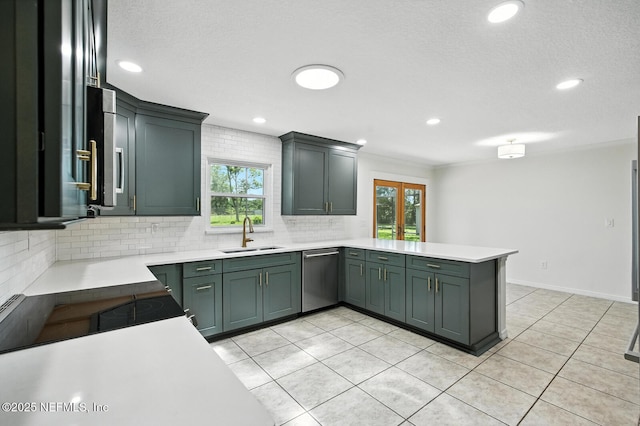 2181 Glenwood Hammock Rd, Deland, FL 32720 - kitchen featuring stainless steel dishwasher, a peninsula, decorative backsplash, light countertops, and recessed lighting