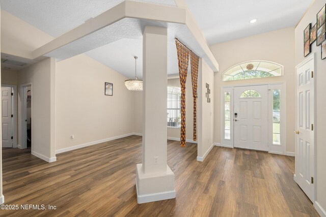 8 Village Cir, Palm Coast, FL 32164 - entrance foyer with wood finished floors, a chandelier, and recessed lighting