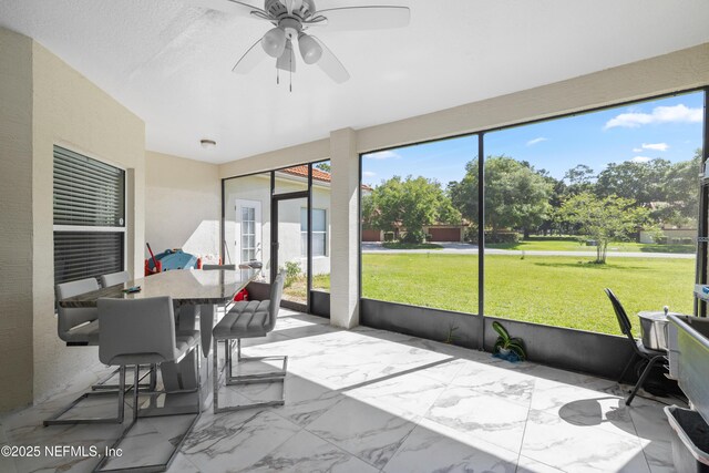 8 Village Cir, Palm Coast, FL 32164 - sunroom / solarium featuring a ceiling fan and outdoor dining area