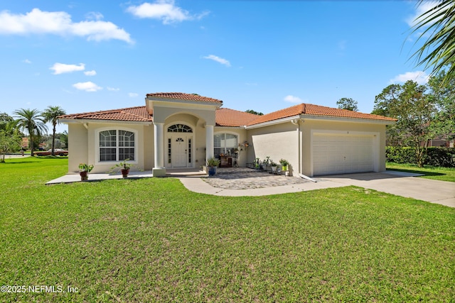 8 Village Cir, Palm Coast, FL 32164 - mediterranean / spanish-style house with stucco siding, a tiled roof, concrete driveway, an attached garage, and a front lawn