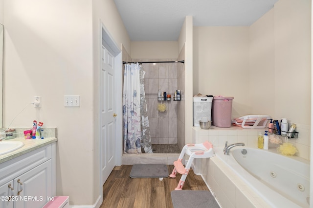 8 Village Cir, Palm Coast, FL 32164 - bathroom with a tub with jets, a tile shower, vanity, and wood finished floors