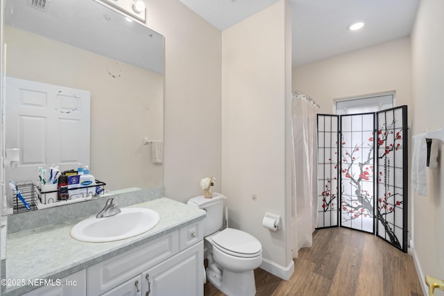 8 Village Cir, Palm Coast, FL 32164 - full bathroom with vanity, wood finished floors, and a shower with curtain