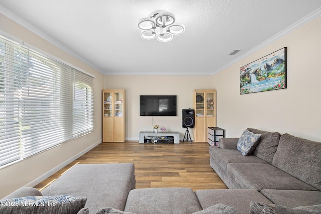 8 Village Cir, Palm Coast, FL 32164 - living area with crown molding, wood finished floors, and a chandelier