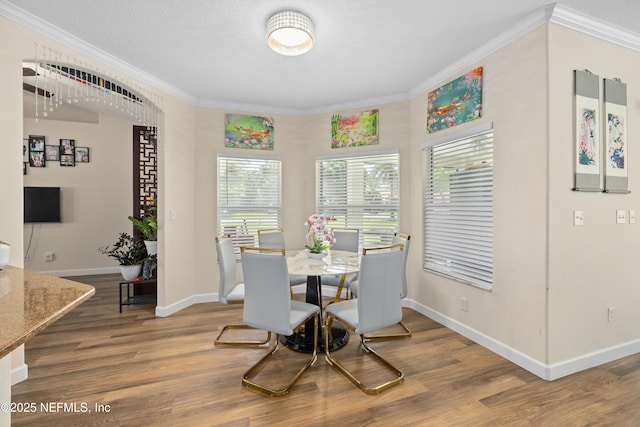 8 Village Cir, Palm Coast, FL 32164 - dining area featuring wood finished floors and crown molding