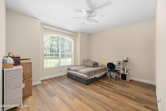 8 Village Cir, Palm Coast, FL 32164 - bedroom featuring wood finished floors and a ceiling fan