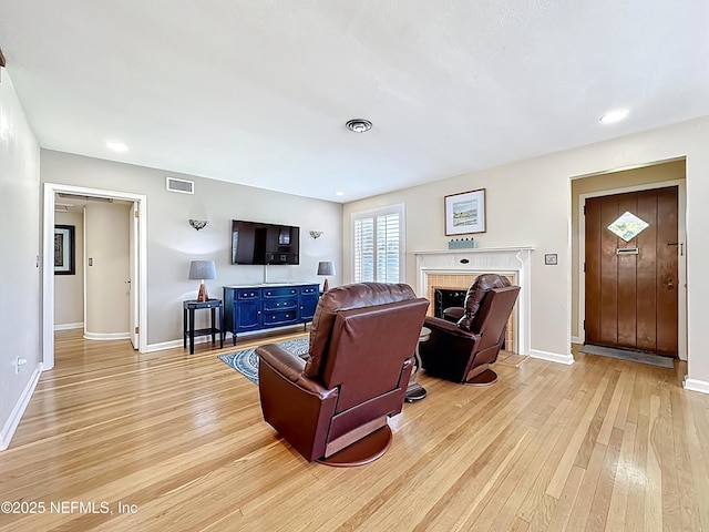 1445 Peachtree St, Jacksonville, FL 32207 - living area with light wood-style floors and a fireplace