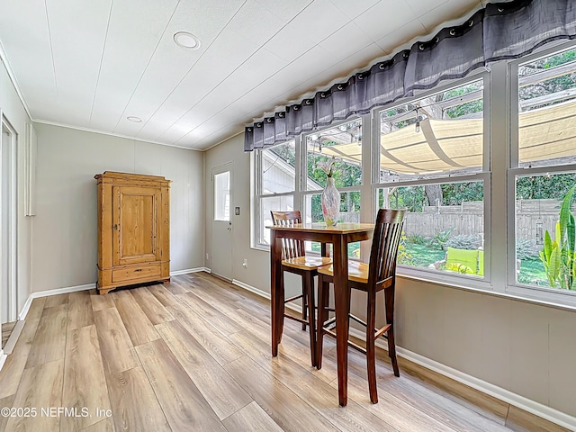 1445 Peachtree St, Jacksonville, FL 32207 - dining space with light wood finished floors and ornamental molding