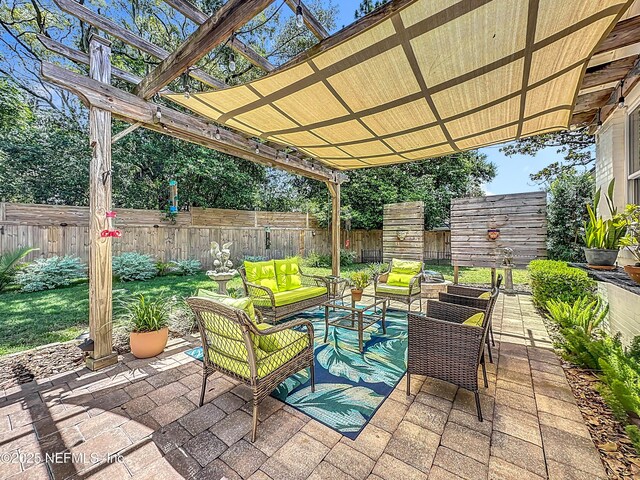 1445 Peachtree St, Jacksonville, FL 32207 - fenced backyard featuring an outdoor living space, a pergola, and a patio