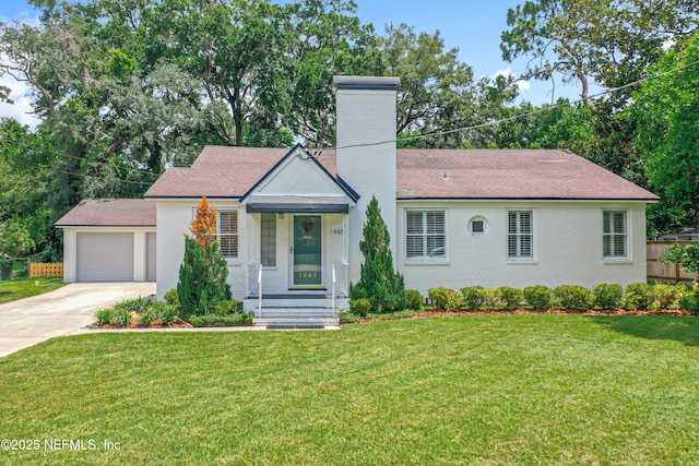 1445 Peachtree St, Jacksonville, FL 32207 - view of front of home with driveway, a chimney, and a front yard