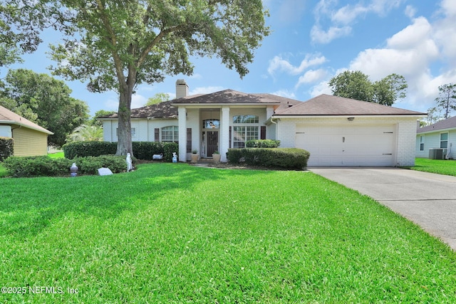 1571 Shelter Cove Dr, Fleming Island, FL 32003 - ranch-style house with concrete driveway, a garage, a front yard, and brick siding