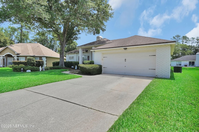 1571 Shelter Cove Dr, Fleming Island, FL 32003 - single story home with brick siding, concrete driveway, a front yard, and an attached garage