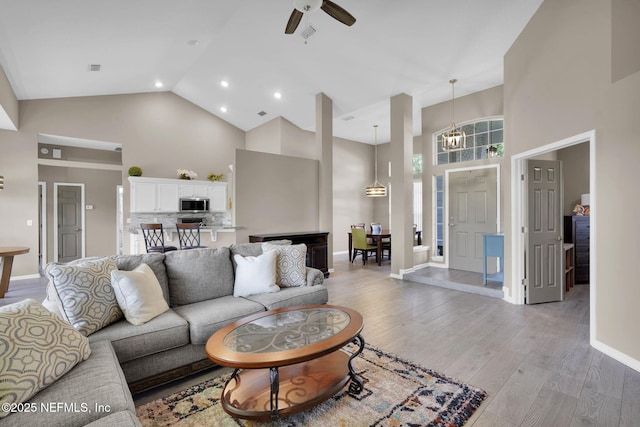 1571 Shelter Cove Dr, Fleming Island, FL 32003 - living area featuring high vaulted ceiling, light wood-style floors, ceiling fan, and recessed lighting