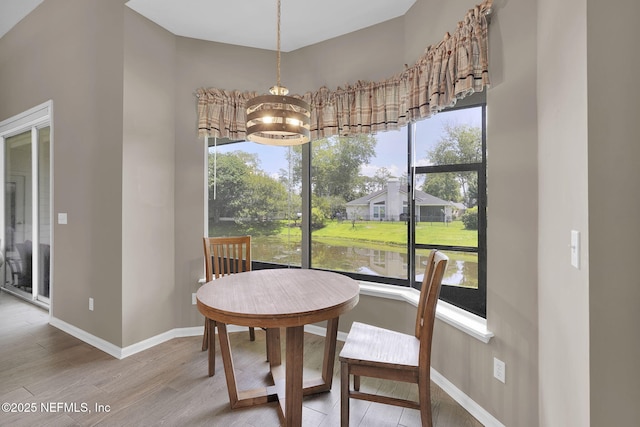 1571 Shelter Cove Dr, Fleming Island, FL 32003 - dining space featuring wood finished floors and a chandelier