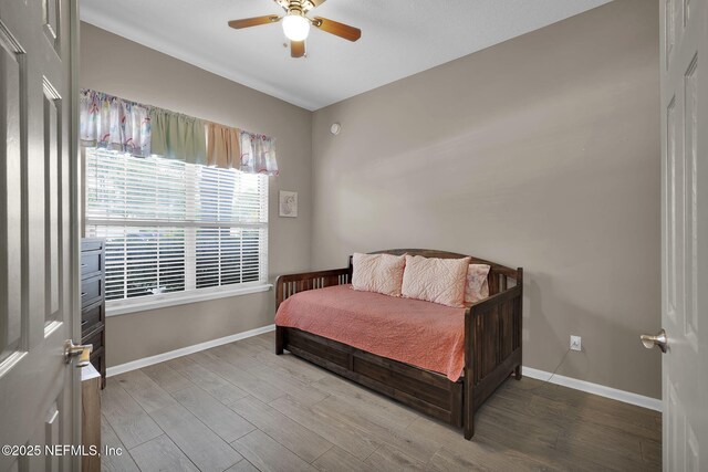 1571 Shelter Cove Dr, Fleming Island, FL 32003 - bedroom featuring wood finished floors and a ceiling fan