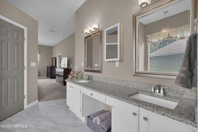 1571 Shelter Cove Dr, Fleming Island, FL 32003 - bathroom with double vanity, a chandelier, and marble finish flooring