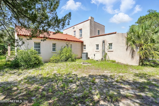150 Calle Menendez, Saint Augustine, FL 32086 - rear view of house featuring stucco siding and a tiled roof