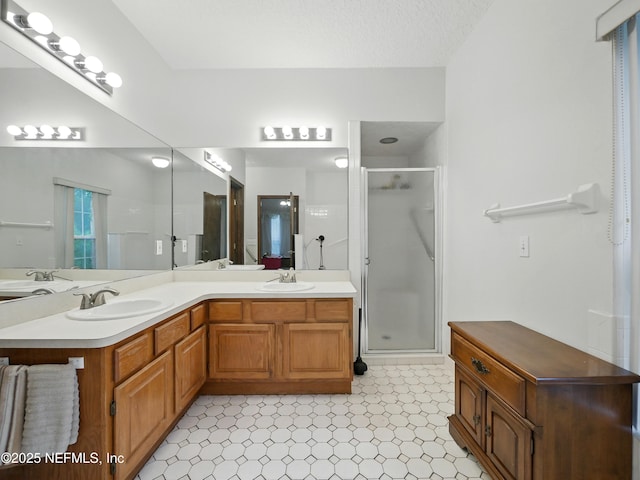 150 Calle Menendez, Saint Augustine, FL 32086 - bathroom featuring a shower stall, double vanity, and tile patterned floors