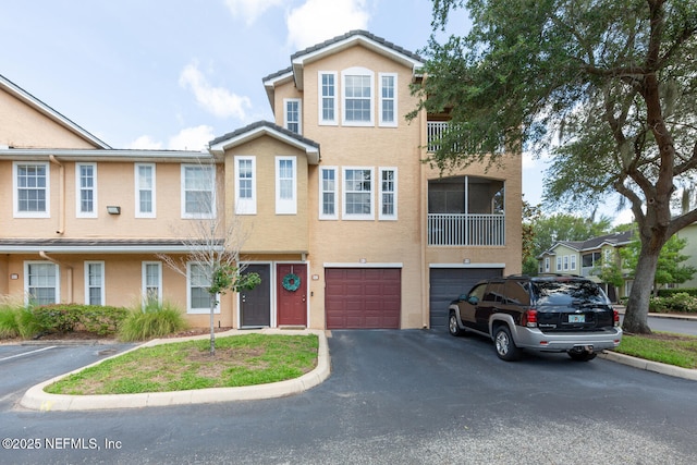 10075 Gate Pkwy N Unit 913, Jacksonville, FL 32246 - townhome / multi-family property featuring stucco siding, driveway, and an attached garage