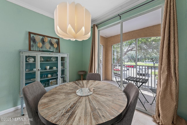 10075 Gate Pkwy N Unit 913, Jacksonville, FL 32246 - dining area featuring ornamental molding and tile patterned floors